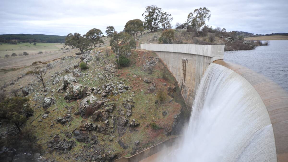 Water flows over the wall at Suma Park dam. Photo: JUDE KEOGH