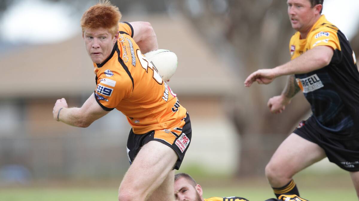 ON FIRE: Regan Hughes trucks the ball up for Canowindra on Sunday. Photo: RS WILLIAMS