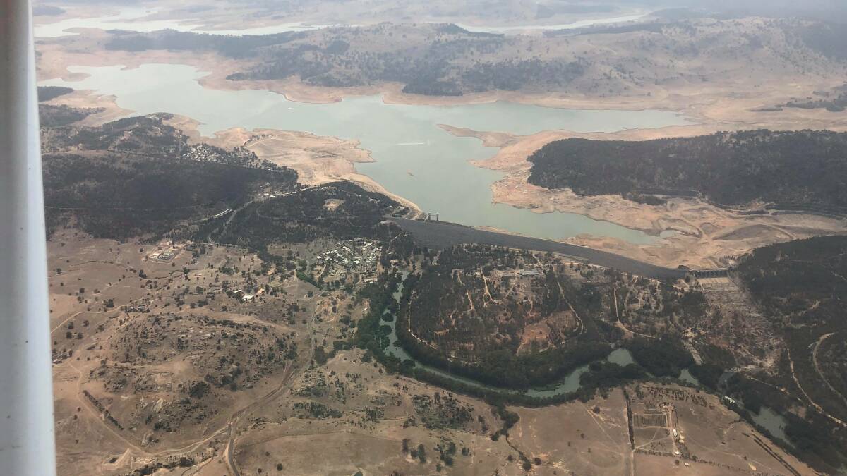 DRY, AND LOW: An aerial view over Wyangala Dam shows how low the water line is after one of the worst droughts the region has endured. Photo: RICK MIDDLETON