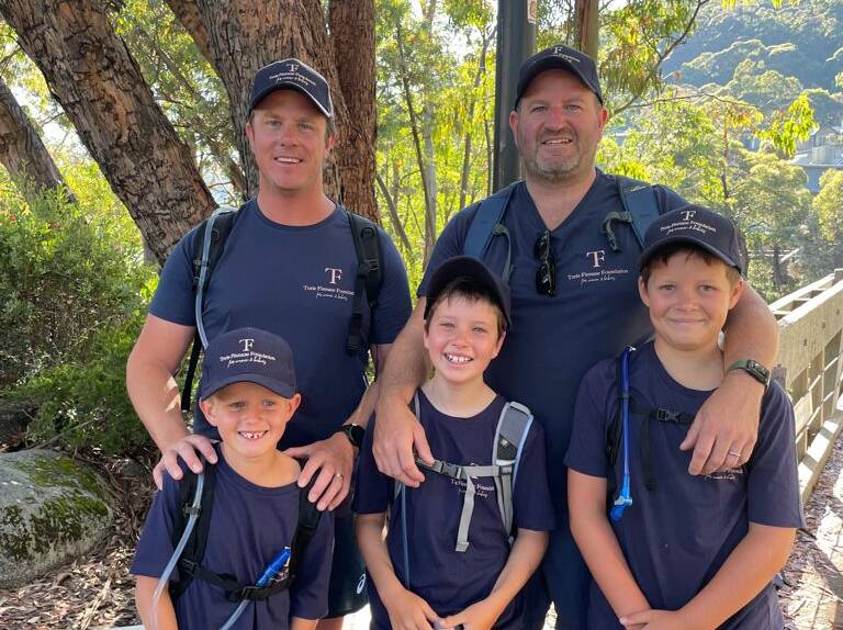 INSPIRING EFFORT: Ollie Finnane, 6, from Orange, Ted O'Hare, 8, from Wagga and Finn Gibson, 10, from Sydney supported by Dads Liam Finnane and Geoff O'Hare at the Mountain Kosciuszko summit walk on Australia Day. Photo: Courtesy, Genevieve O'Hare.