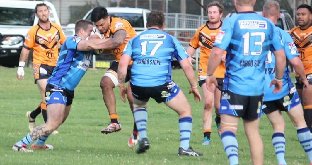 ON THE BURST: Canowindra gun Semisi Tupou storms into the Cargo defensive line on Saturday. He scored two tries. Photo: CARGO BLUE HEELERS