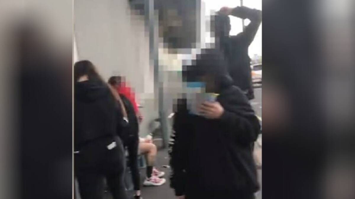 A still from the video posted on Facebook, in which a group of teenagers abuse and intimidate a Vietnamese university student in Mowbray.