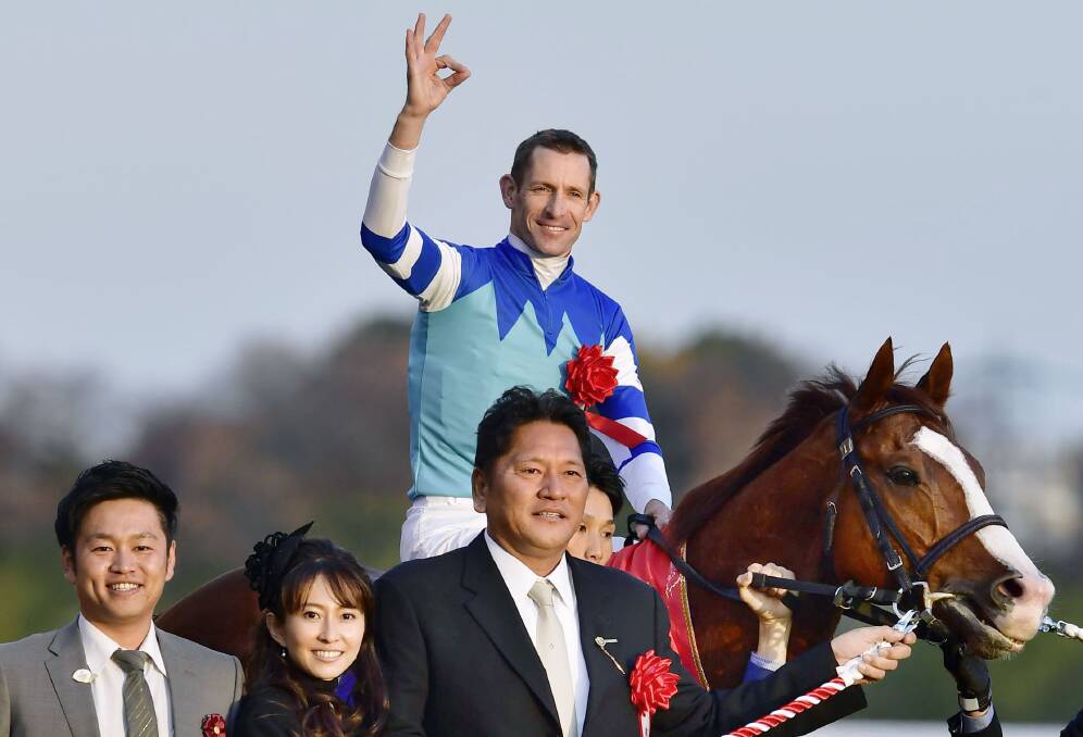 SUPERSTAR: Hugh Bowman with the connections of Cheval Grand after winning the Japan Cup. Bowman will officially be crowned the world's best jockey this week.