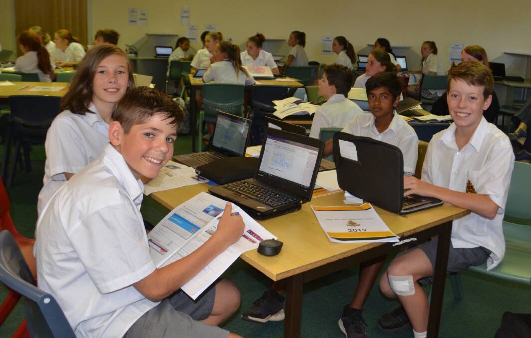 DIGITAL LEARNING: Year 7 students Makenzi Douglass, Clayton Graham, Hussein Sharif and Darcy Kelly attend an e-learning boot camp workshop on Wednesday. 