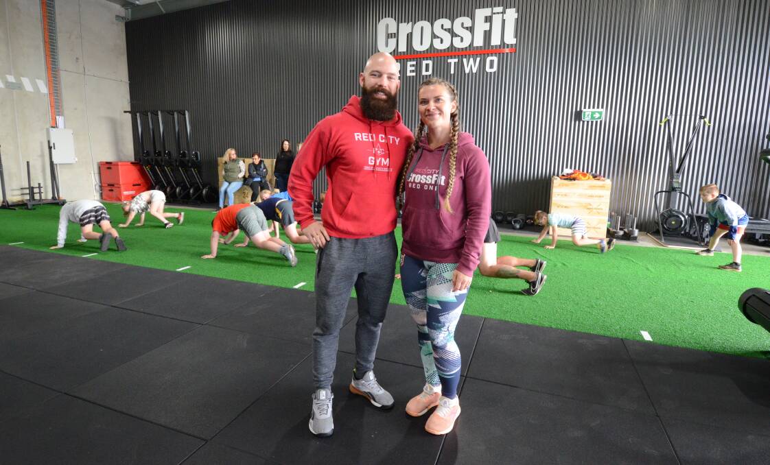 OPEN: Lachlan Learg and Karina Peters opened Crossfit Red Two on Saturday in Dalton Street. Photo: JUDE KEOGH