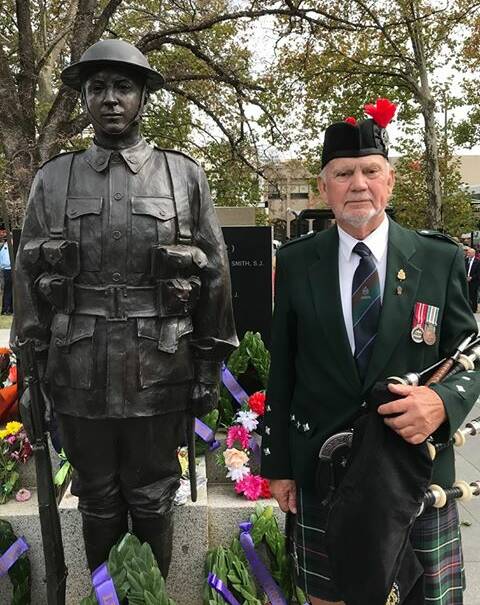 TRADITION: Don Peck, pictured at the war memorial in 2019, has played the bagpipes at Anzac Day services for almost 50 years, except this year when he played Amazing Grace from his driveway. Photo: SUPPLIED