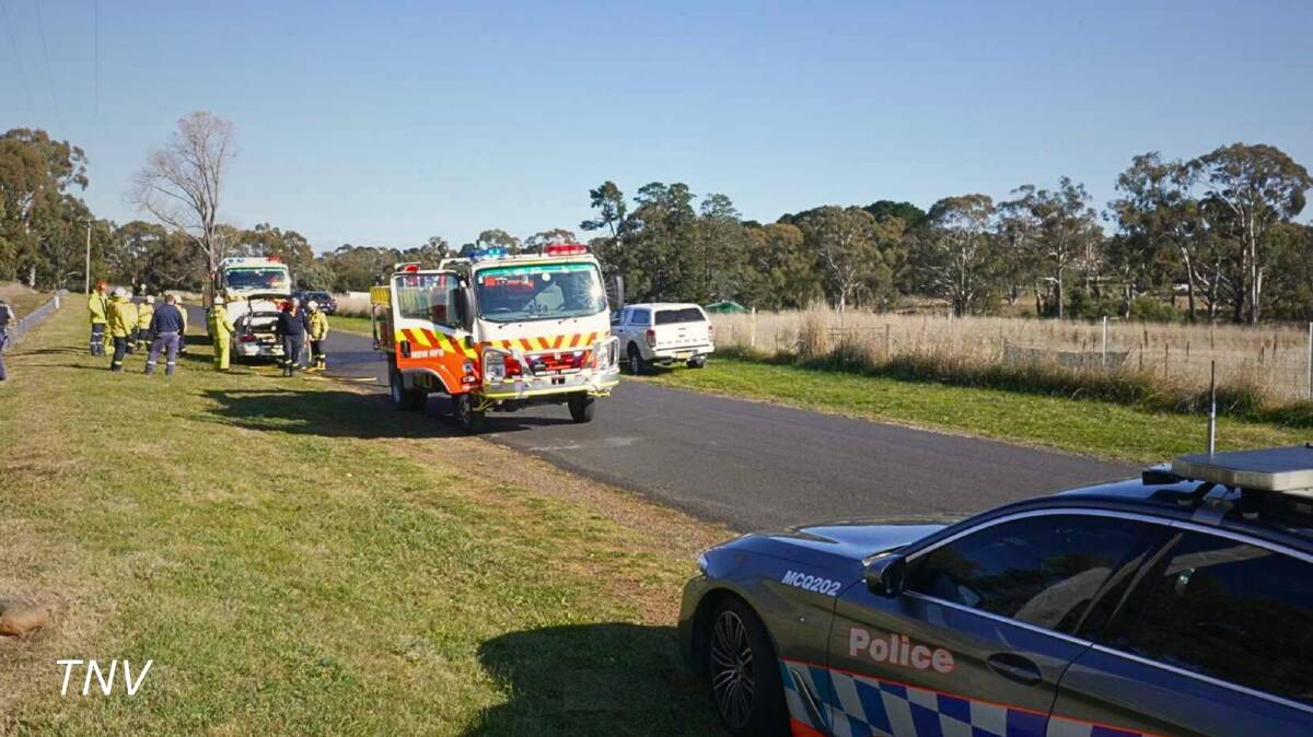 Emergency services at the scene where the Subaru Impreza driven by Eggins in the crime spree was burnt. Picture by Troy Pearson.
