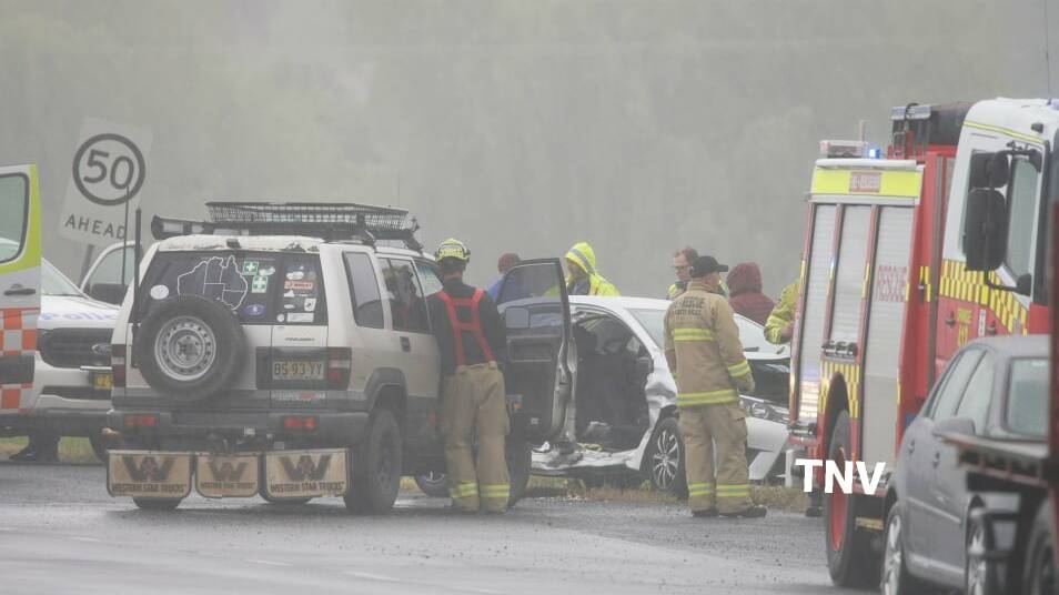 CRASH: Emergency services attend the scene of a two-car crash. Photos: TROY PEARSON