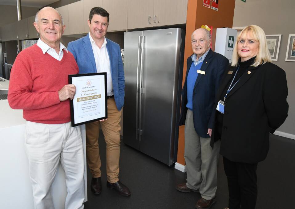 GRATEFUL: John Carpenter with Andrew DeGraaff from Orange Credit Union and Dr Stuart Porges and Jan Savage at Western Care Lodge. Photo: JUDE KEOGH