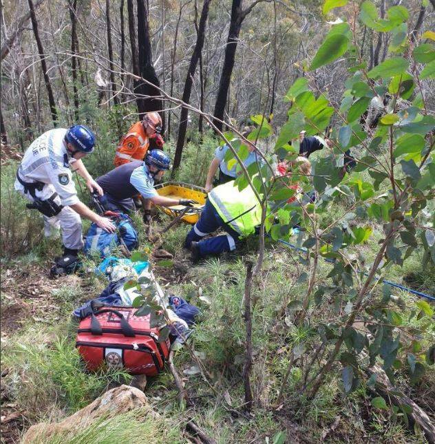 RESCUE OPERATION: State Emergency Service and police crews rescue a teenager on Mount Canobolas on Wednesday. Photo: SES