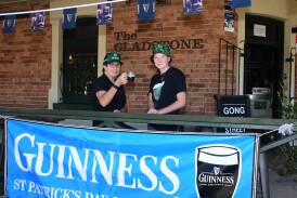 Kerrie Evans and Jessie Tudor with a glass of Guinness outside The Gladstone Hotel are prepared for St Patrick's Day celebrations. Picture by Carla Freedman