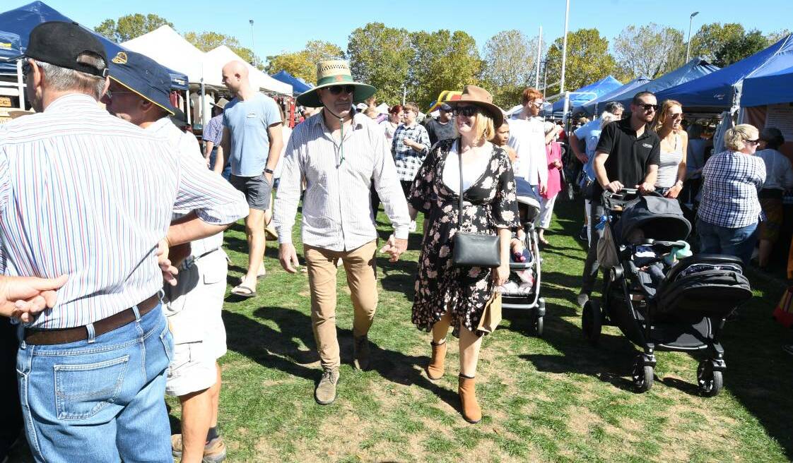 WEAVING THROUGH CROWD: Steve and Tracey Sharah at the Millthorpe Market in April last year. Photo: CARLA FREEDMAN