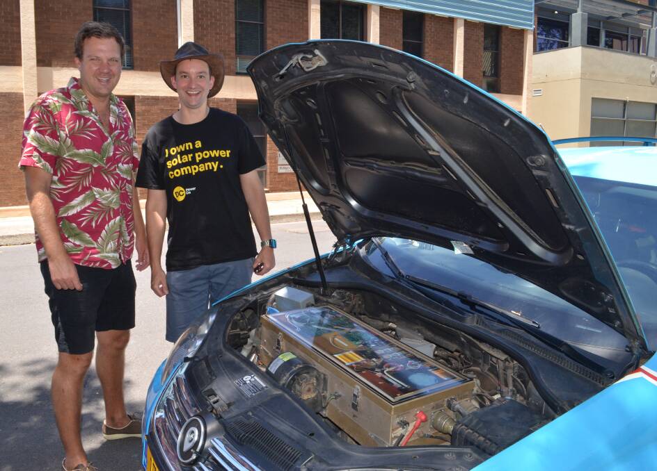 HOSPITALITY: Wiebe Wakker with Orange host Granton Smith and the Blue Bandit, his electric car, which previously had a Volkswagen diesel engine.  