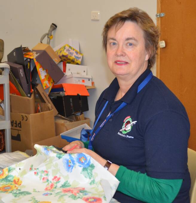 FOR THE CHILDREN: Robyn Hicks volunteers each month to make items and pack gift boxes to send to children in developing countries as part of the Samaritan's Purse Operation Christmas Child. Photo: TANYA MARSCHKE