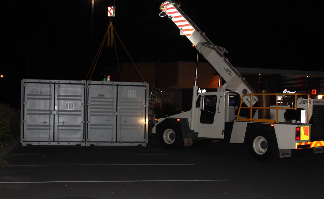 DELIVERED: A crane was used to lift the bottle recycling machine off a truck outside the North Orange Shopping Centre on Monday. Photo: SUPPLIED