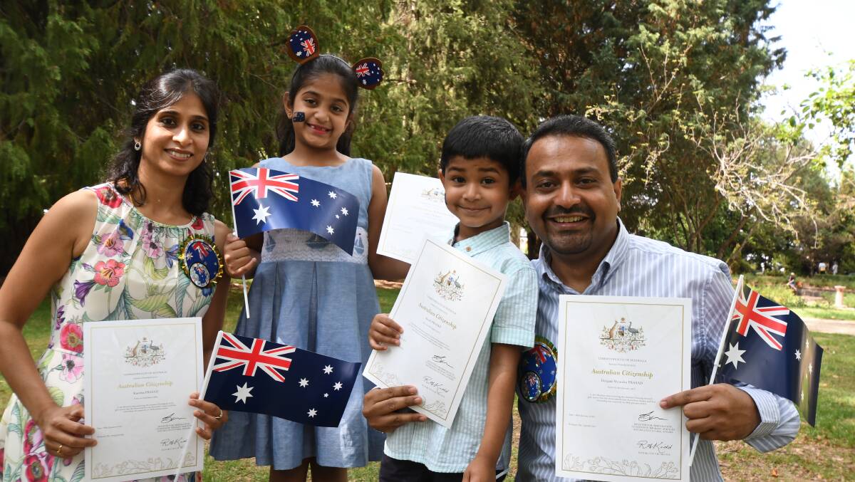 AUSTRALIANS: Kavitha, Disha, Ayush and Deepak Prasad became Australian citizens during the Australia Day ceremony. Photo: CARLA FREEDMAN 