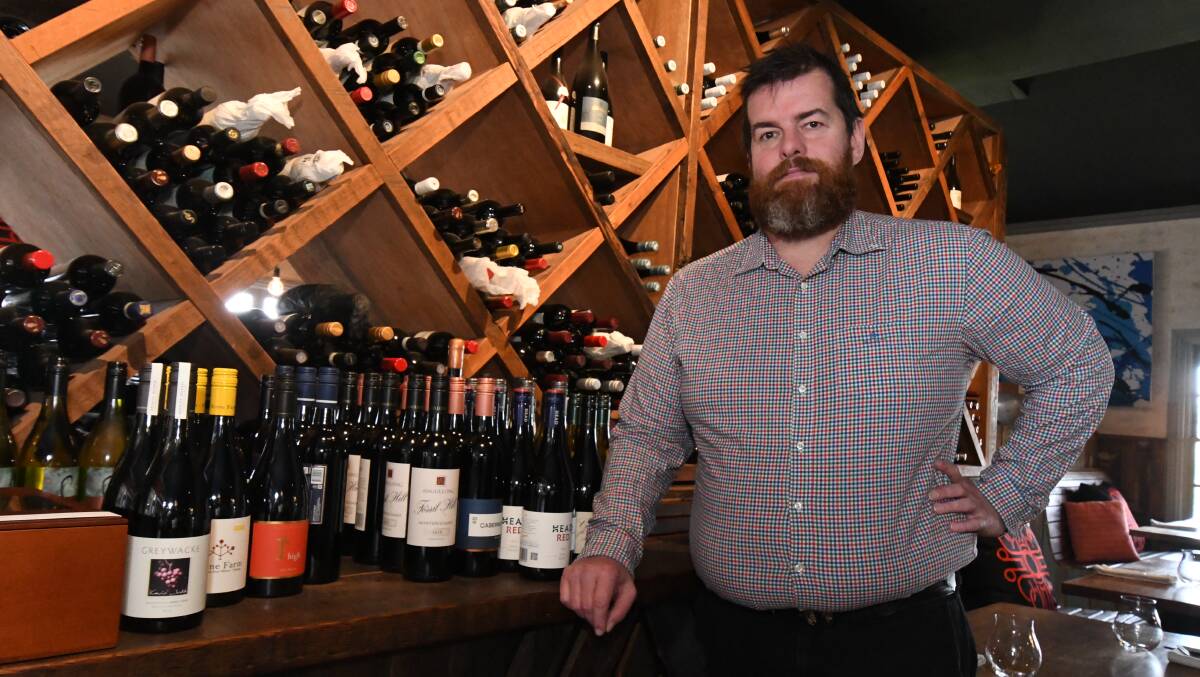 WIN: David Collins from Charred Kitchen & Bar has won a NSW Sommelier's Award for his wine list, which has 244 wines from all over NSW. Photo: JUDE KEOGH