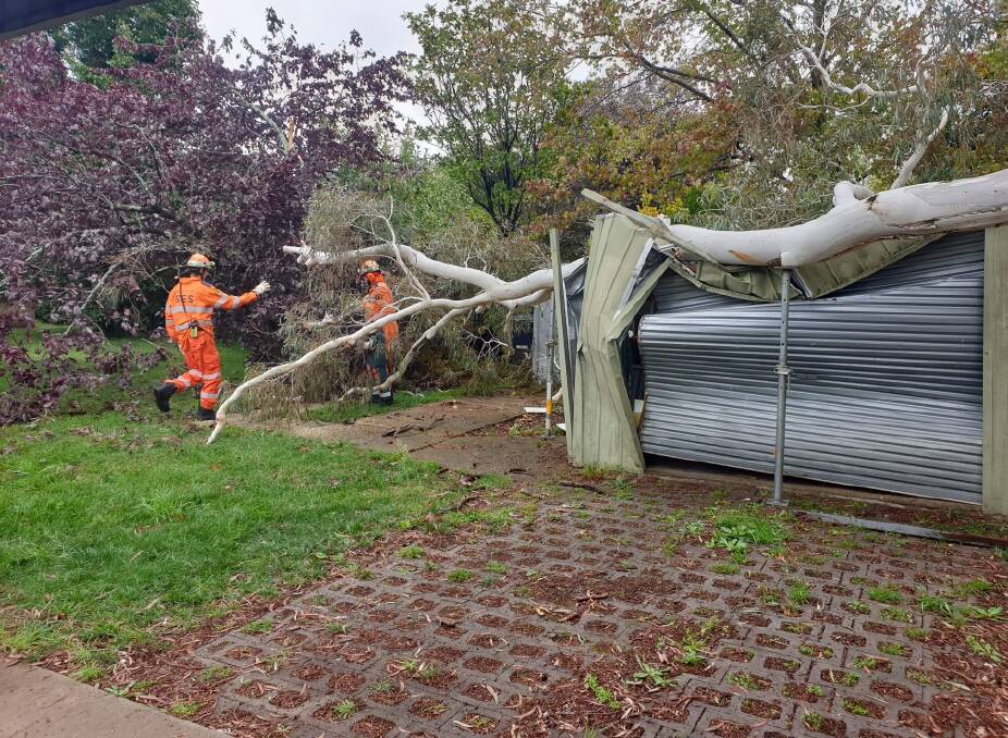 DAMAGE: Orange City SES were called to remove a tree that fell onto a garage in March Street on Friday morning. Photo: SUPPLIED 