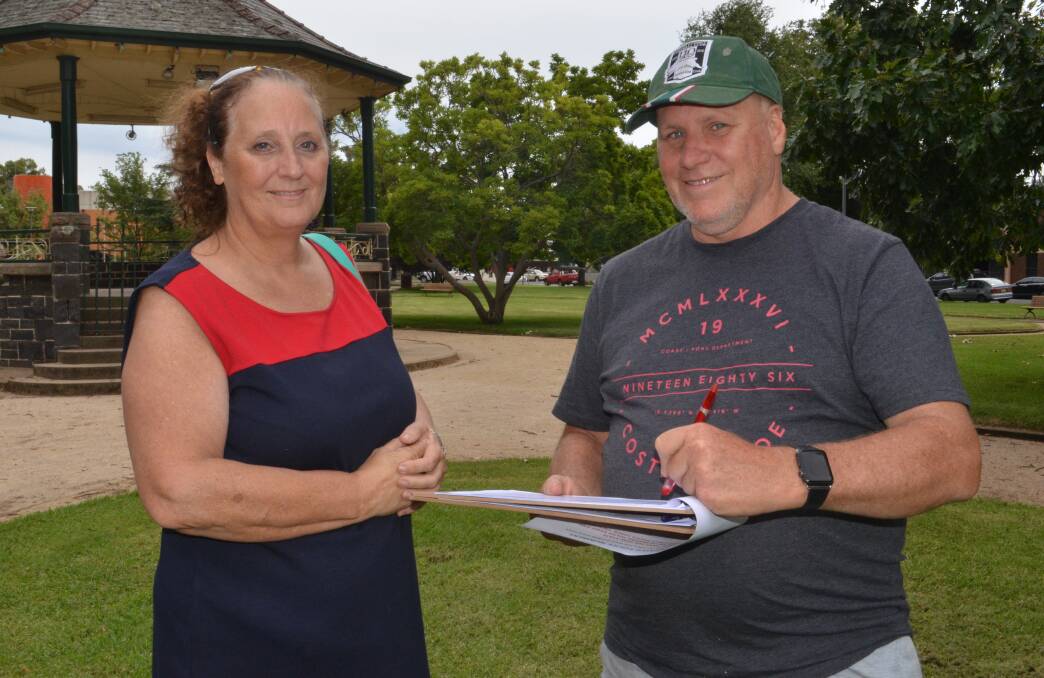 SIGNING UP: Petition organiser and campaigner Debbie Thornton with Mark Garey who suggested sprint car racing as an activity to do as part of the 40 days of adrenalin initiative.  