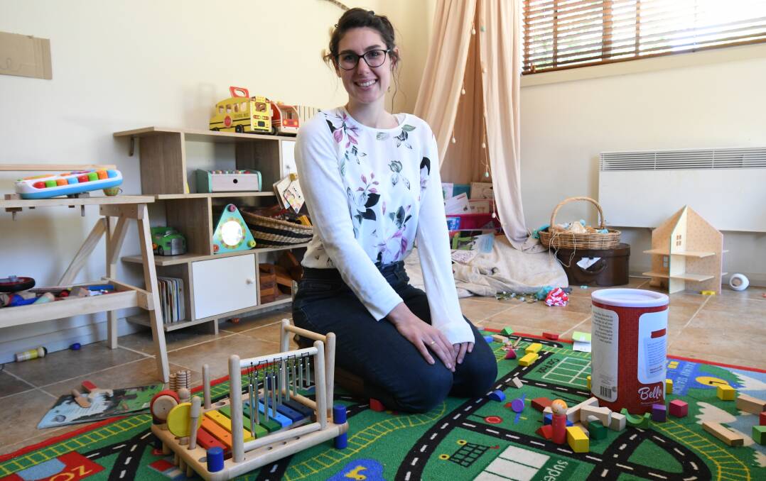 WORK FROM HOME: Family Daycare means Kellie Ward can work with children and stay home with her daughter. Photo: JUDE KEOGH