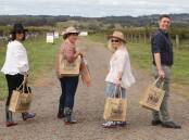 SUSTAINABLE EVENT: Cally Woodhouse, Kim Dickerson, Christine Whybrow and Ben McNiven with their reusable FOOD Week bags at Forage earlier this year. Photo: CARLA FREEDMAN 