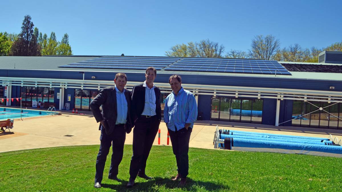 SOLAR INSTALLATION: Mayor Reg Kidd, Orange City Council's development services director Dave Waddell and Kenjarhy Solar director Brad Draper at Orange Aquatic Centre in October after solar panels were installed. Photo: CONTRIBUTED
