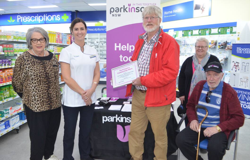 COMMUNITY HERO: Orange Parkinson's Support Group members Petah Duffy, Bernie Duffy, Patricia O'Brien and Andrew O'Brien, with Blooms the Chemist owner Melanie Moses second from left. Photo: TANYA MARSCHKE