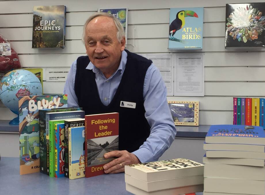 POPULAR READS: Collins Booksellers owner Phillip Schwebel with some of the most popular books that are currently selling at the book shop. Photo: TANYA MARSCHKE