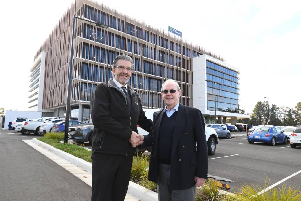 OPENING: Zauner Construction's Garry Zauner and James Richmark's Frank O'Halloran outside Bloomfield Medical Centre. Photo: JUDE KEOGH