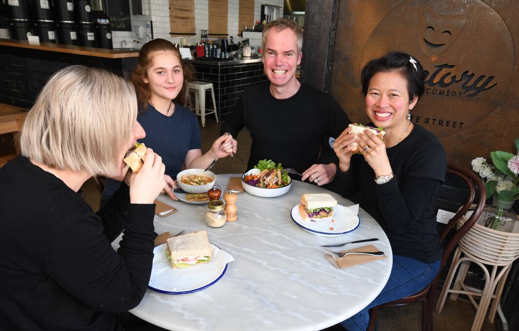 NEW MENU: Bec Jackson, Alani Nepe, with Factory Espresso owners Nick and Ruby Gleeson with the sandwiches and salads from the new menu. Photo: JUDE KEOGH
