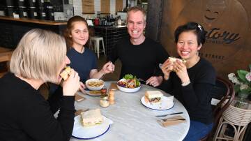 NEW MENU: Bec Jackson, Alani Nepe, with Factory Espresso owners Nick and Ruby Gleeson with the sandwiches and salads from the new menu. Photo: JUDE KEOGH
