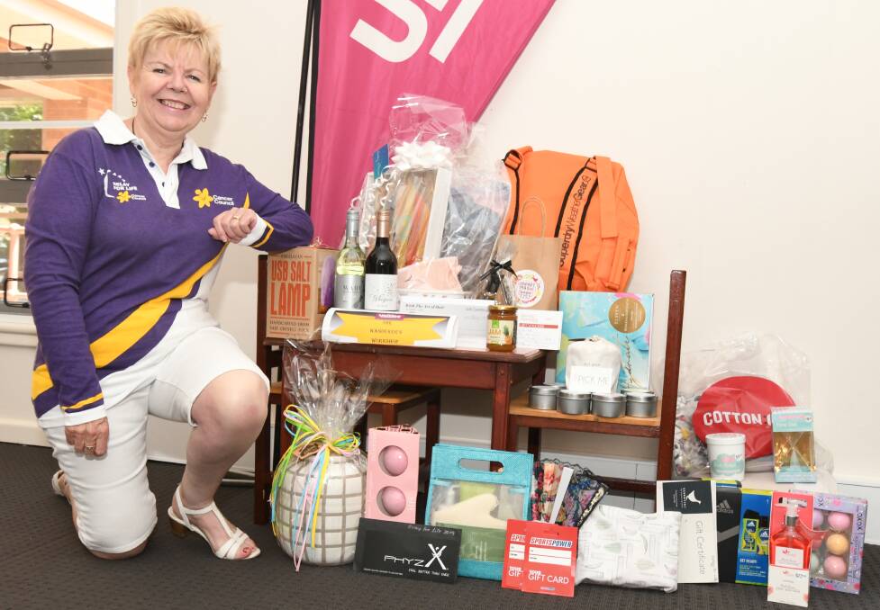 DEDICATED: Care Bears United team leader Dorothy West with raffle items. She will shave her head at a fundraising event leading up to the Relay for Life. Photo: JUDE KEOGH