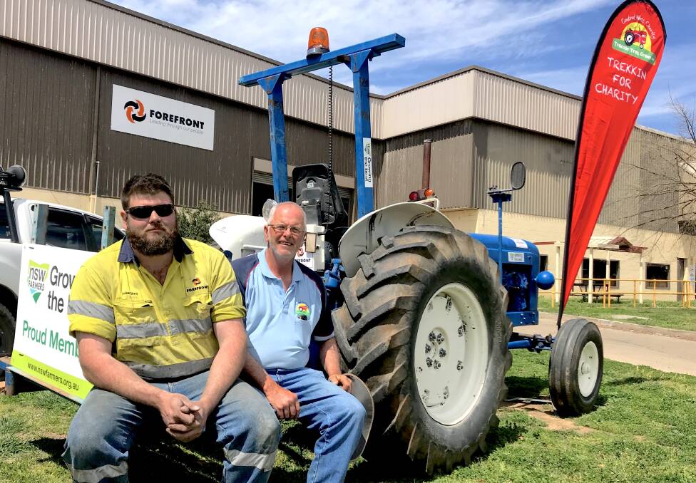 READY TO ROLL: Adam Sharp and father John Sharp are ready to take part in the 2018 Central West Tractor Trek, on a blue farm tractor. The trek is running on Friday, Saturday and Sunday across the Cabonne area. Photo: SUPPLIED