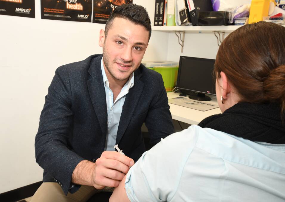 PREVENTION: StarChem Discount Pharmacy pharmacist in charge Mike Wehbi says people should get the influenza vaccine if they haven't already. Photo: JUDE KEOGH