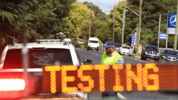 A file picture of a vehicle stopped at a police road side breath testing site. File picture