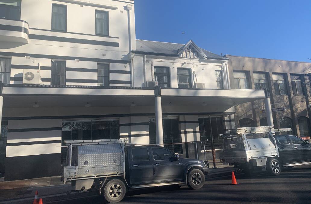 OPEN: Tradesmen arrived early at the Royal Hotel after a fire protection system main burst on Wednesday night. Photo: TRACEY PRISK