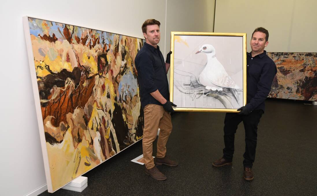 COLLECTION ON EXIHIBITION: Orange Regional Gallery acting collections manager Mike Allen and director Bradley Hammond with a Brett Whitley painting that will be on exhibition. Photo: JUDE KEOGH