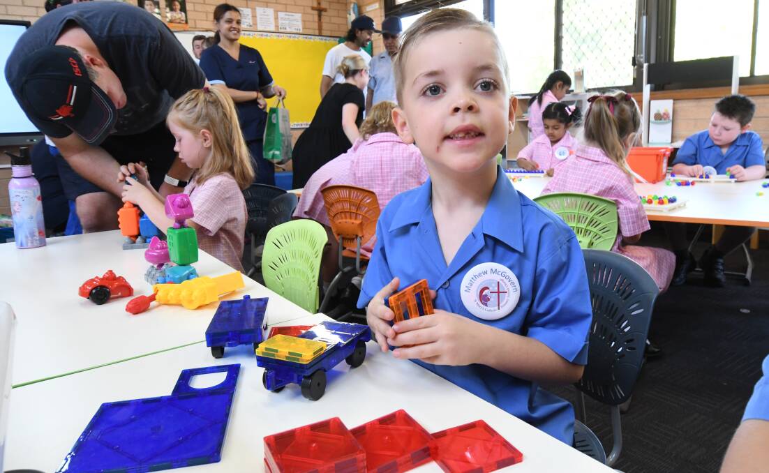 BUSY: Matthew McGovern started his first day of kindergarten at St Mary's Catholic Primary School on Thursday. Photo: JUDE KEOGH