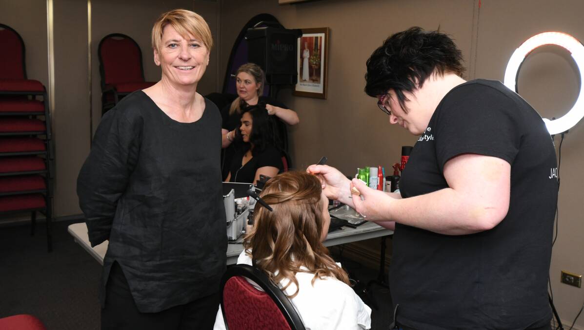 MAKEOVER: Orange Women's Shed support worker Paula Beattie with Styling by Jackie Browne stylists Lisa Hanrahan and Jackie Browne doing hair and makeup on Gabrielle Yates and Kelly Beckett. Photo: JUDE KEOGH  