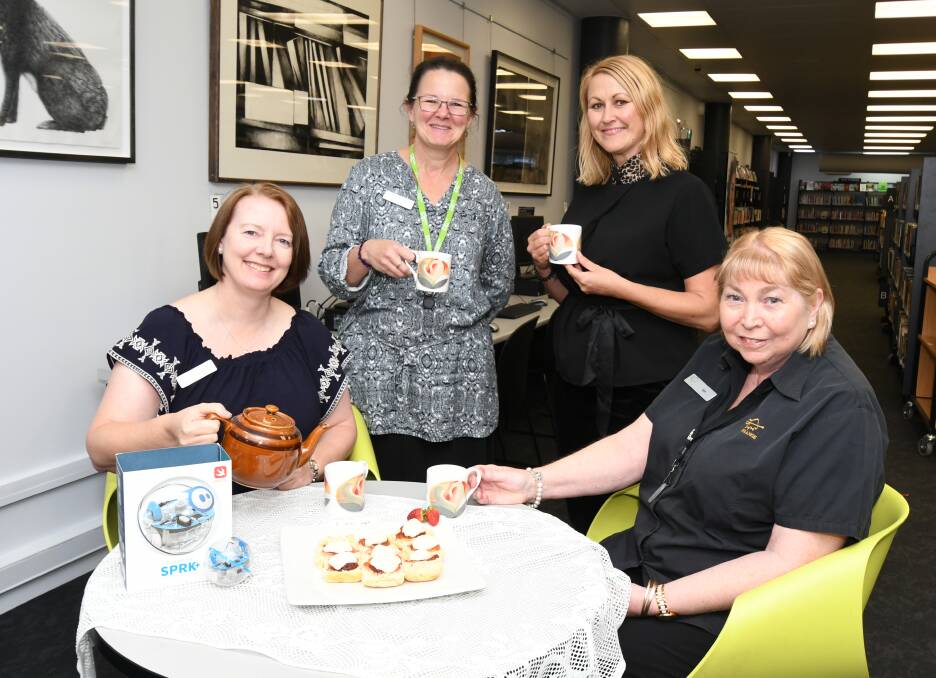SCONES AND STORIES: Jasmine Vidler,Monica Engel, Tammy Wilson and Lyn Bugden are ready to host the first Seniors' Week activity at Orange City Library on Monday. Photo: JUDE KEOGH 