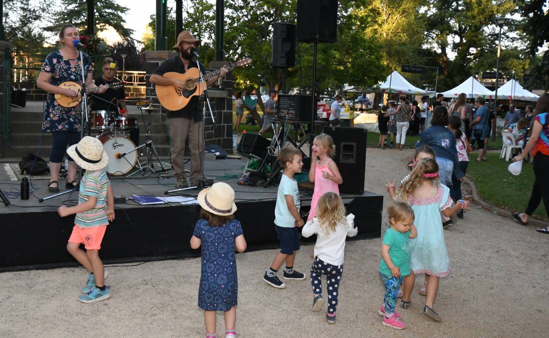 ENTERTAINING: Children dance along to live music at the Banjo Paterson Australian Poetry Festival Night Market in Robertson Park last year. Photo: JUDE KEOGH
