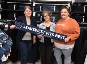 RELOCATING: Jeanswest employees Amanda Selwood, Robyn Travis, Jessica Thompson. Photo: JUDE KEOGH
