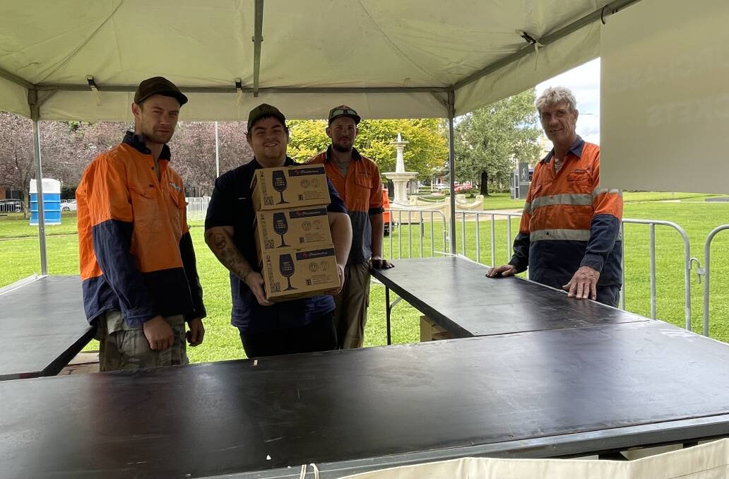 WINE GLASS DELIVERY: Chris Pollack, Travis Jones, Joshua Taylor and Peter Marchant worked with Tully Enterprises to set up the stalls for the annual FOOD Week Night Markets.
