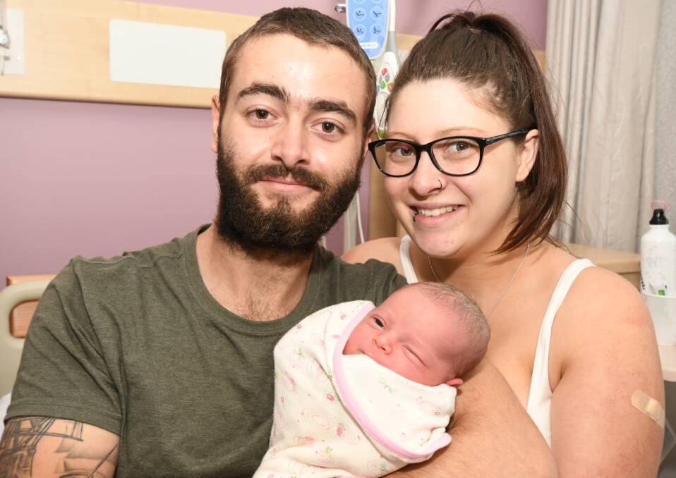 LOVEABLE GIFT: Shane Wright, Danielle Haggar with baby Skyla Grace Wright who was born on Christmas Day. Photo: JUDE KEOGH