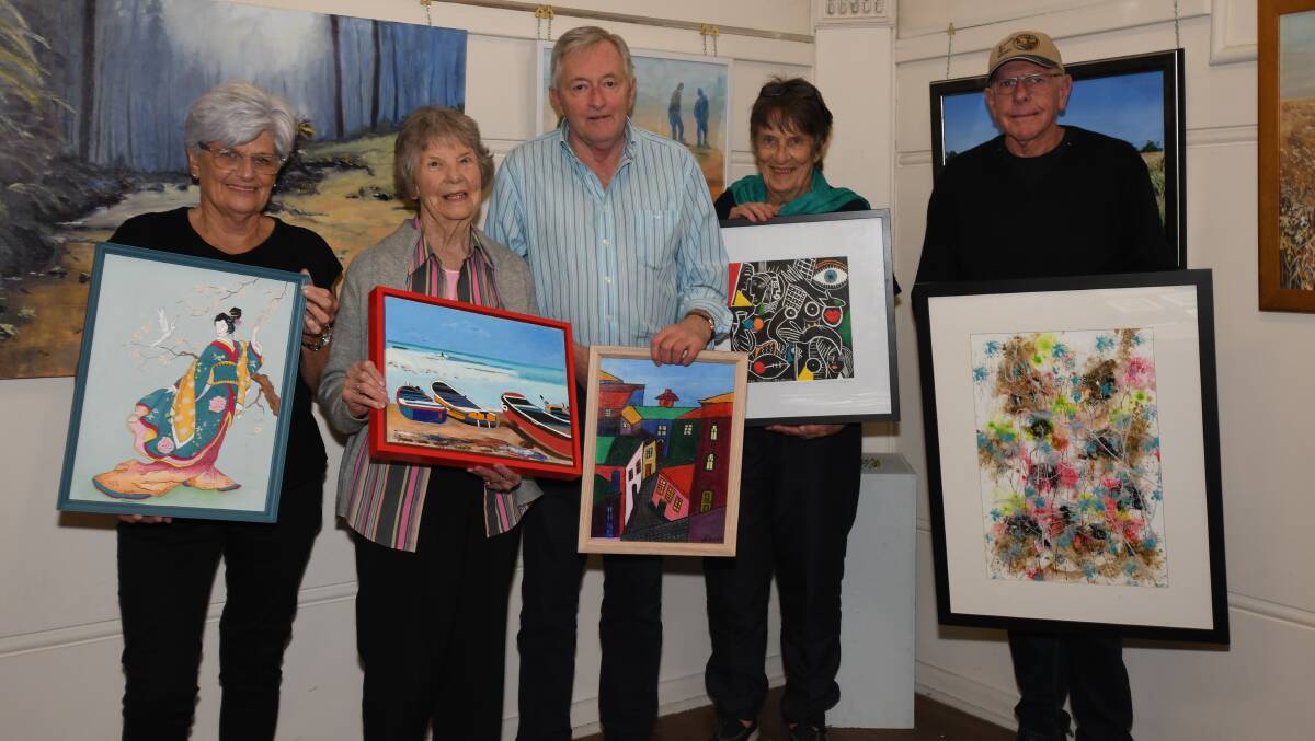 FRESH EXHIBIT: Orange Art Society members Kay Kennedy, Jean Carney, Noel McCumstie, Kay Partridge and Tony Kennedy with some of the artworks that were hung on Sunday. Photo: CARLA FREEDMAN