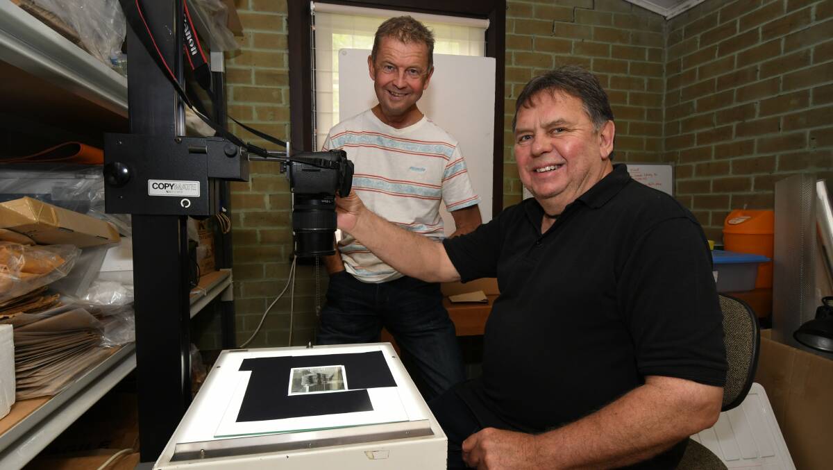 LABORIOUS: Toney Fitzgerald and Orange and District Historical Society volunteer John Kich with the camera and lightbox which are currently used for digitising photograph's from the society's vast collection. Photo: JUDE KEOGH  