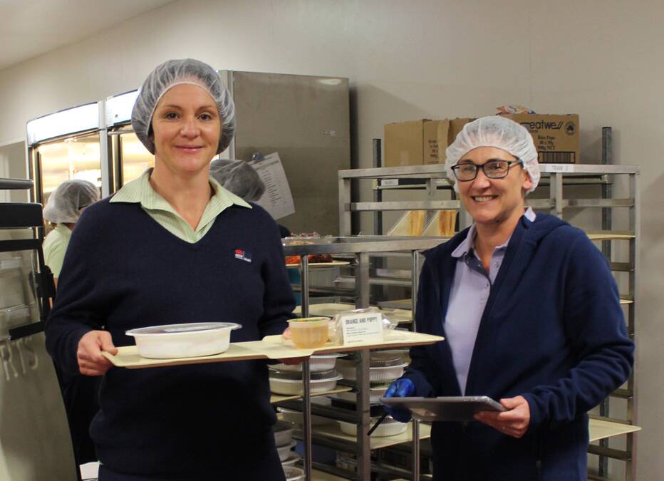NEW SERVICE: Brooke Holmes and Tina Gillette from the food services team at Orange Health Service are serving new dishes to patients. Photo: SUPPLIED