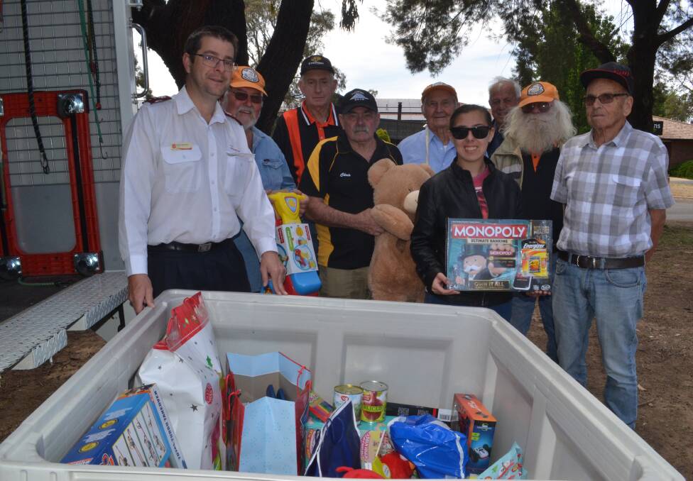 GENEROUS: The Salvation Army captain David Grounds, with toy run participants Bob Nash, Ian Culverson, Chris Wood, Roy Riley, Jennifer Bragg, Frank Hasall, Keith 'Chalky' Bragg and John Weekes who donated presents. 