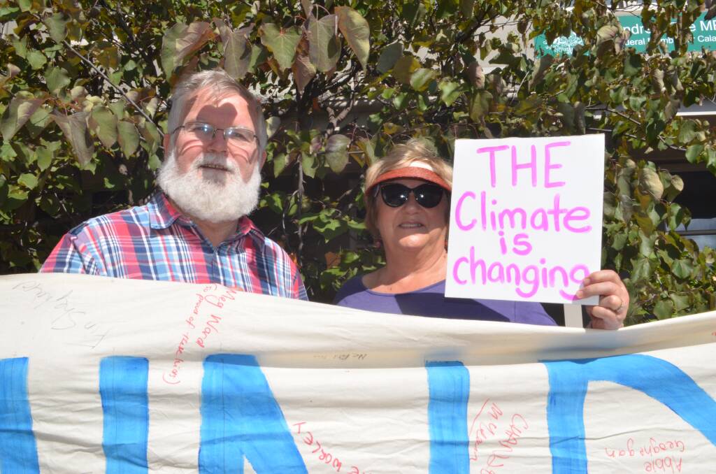 STANDING UP: Tim and Penny Hammond joined in the silent vigil on the footpath outside Andrew Gee's office.