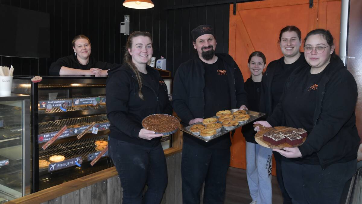 Emily Beach, Gabby Thompson, Mitchell Brown, Elise Costello, Danielle Kiel, Rebekah McMillan holding pies at the new Orange Pie Company shop at the Village on Summer Street. Picture by Carla Freedman